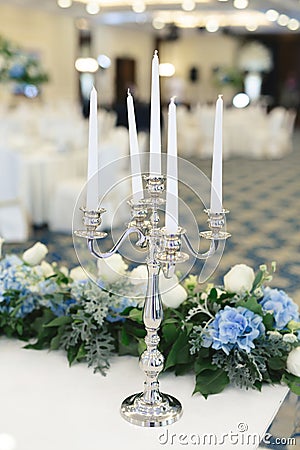 Wedding candle holder with floral decoration at the wedding banquet Stock Photo