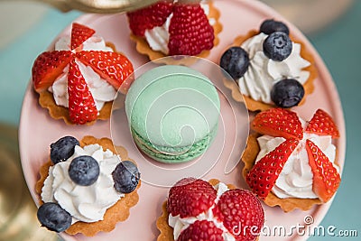 makaroons with berries cakes Stock Photo