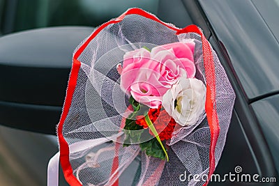 Wedding car decoration, rear-view mirror and artificial flowers Stock Photo