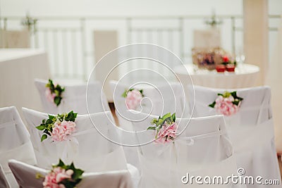 Wedding chair covers with pink flowers Stock Photo