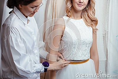 Beauty, wedding concept. tailor and bride Stock Photo
