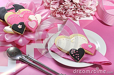 Wedding cookies on pink bridal table Stock Photo