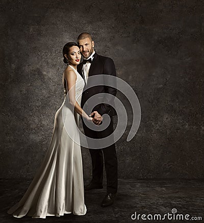 Wedding Couple, Bride and Groom Fashion Portrait, Elegant Suit Stock Photo