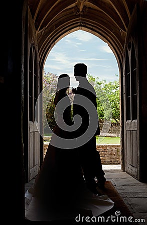 Wedding couple in church entrance Stock Photo