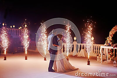 Wedding couple dancing in sparklers their first dance Stock Photo