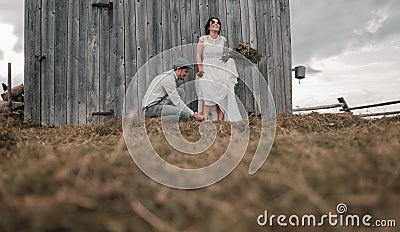 Wedding couple, groom and bride near wedding arch on a background mountain river Stock Photo