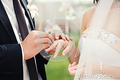 Wedding couple hands close-up during wedding ceremony Stock Photo