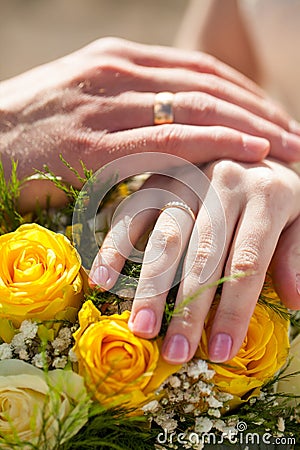 Wedding couple hands with golden rings Stock Photo
