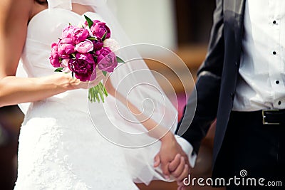 Wedding couple holding hands Stock Photo