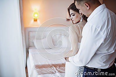 Wedding couple in hotel room Stock Photo
