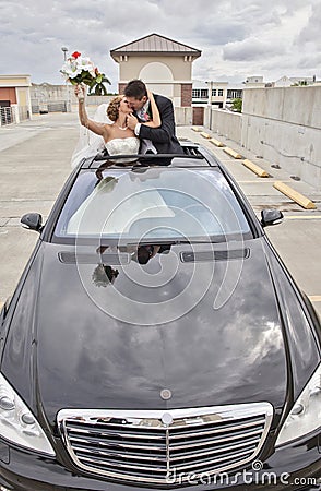 Wedding couple in Limousine sunroof Stock Photo