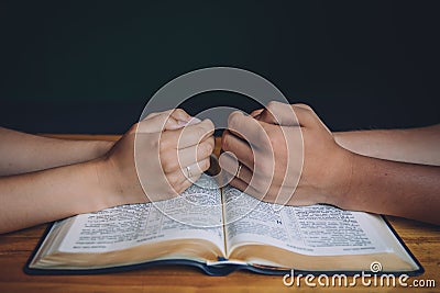 Wedding couple or marriage, praying over the open bible. Stock Photo