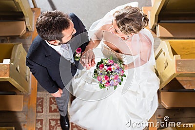 Wedding couple marrying in church Stock Photo