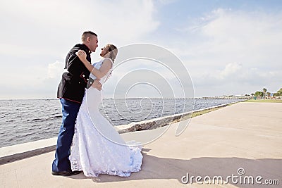 Wedding couple on pier Stock Photo