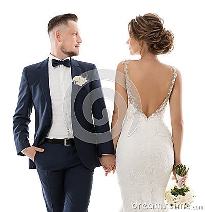 Wedding Couple Profile Portrait, Groom in Classic Suit Bride in White Dress Back Side looking at each other. White background Stock Photo