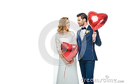 Wedding couple with red heart shaped balloons Stock Photo