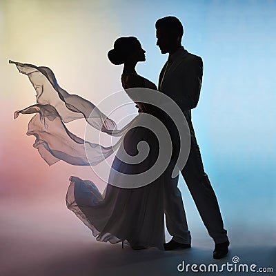 Wedding couple silhouette groom and bride on colors background Stock Photo