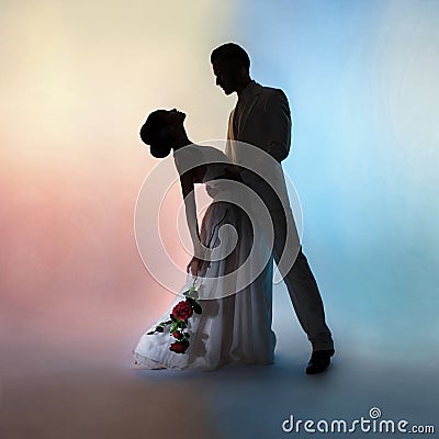 Wedding couple silhouette groom and bride on colors background Stock Photo