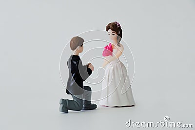 _Wedding couple theme - Bride turning away from groom begging on his knees rejection, change of heart isolated on white Stock Photo