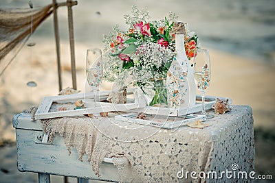 Wedding decor with bottle, glasses, flowers, sea cockleshells an Stock Photo