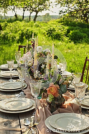 wedding decorated table, decor wedding dinner in nature in the garden Stock Photo