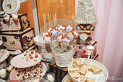 Wedding decoration with pastel colored cupcakes, meringues, muffins and macarons Stock Photo