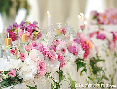 Wedding decoration on table. Floral arrangements and decoration. Arrangement of pink and white flowers in restaurant for event Stock Photo