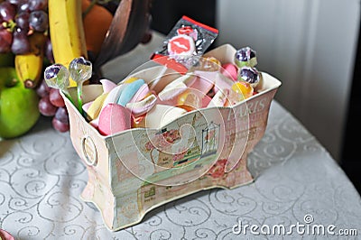 Wedding decorative box with colored candies and lollipops Stock Photo