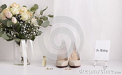 Bride accessories with bouquet and high heel shoes Stock Photo
