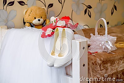 wedding dress of the bride with accessories shoes bear bouquet Stock Photo