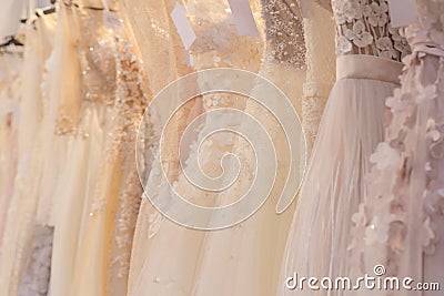 Wedding dresses hang on a hanger in a row Stock Photo