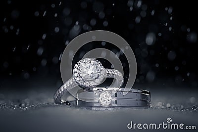 Wedding engagement diamond rings with water drops Stock Photo