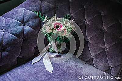 Wedding flowers on the puprle velvet soffa Stock Photo