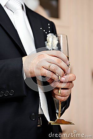 Wedding glass of champagne in hand groom Stock Photo