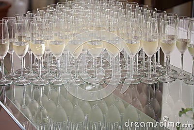 Wedding glasses filled with champagne, ready to be served Stock Photo