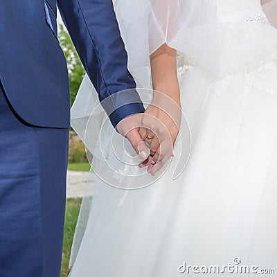 Hands of newly wedded in time of wedding ceremony Stock Photo