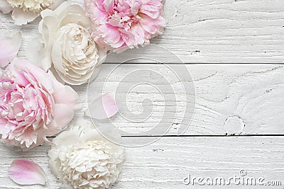 Wedding invitation or anniversary greeting card or Mother`s Day card mockup decorated with pink and creamy peonies Stock Photo