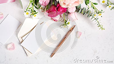 Wedding invitation, event and greeting card with envelop and gold pen on marble background Stock Photo
