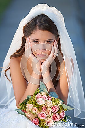 Wedding jitters. a sad-looking young bride on her wedding day. Stock Photo
