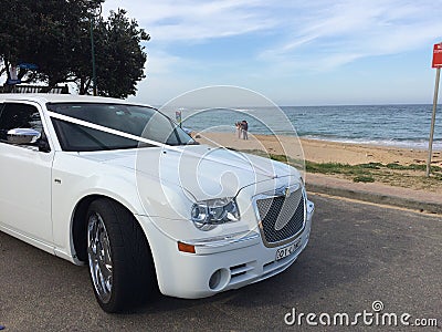 Wedding limousine with sandy beach background Editorial Stock Photo