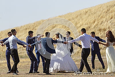 Wedding party at Burana tower ruins, Kyrgyzstan Editorial Stock Photo