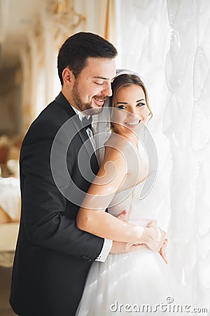 Wedding photo shoot of the newlyweds couple posing in a beautiful hotel Stock Photo