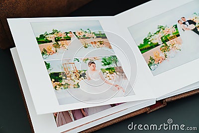 wedding photobook with photos of the newlyweds on a black background Stock Photo
