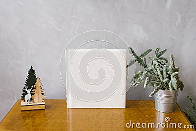 Wedding photobook in white leather cover surrounded by a Christmas tree Stock Photo