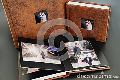 wedding photobooks in brown leather binding with photos on the cover Stock Photo