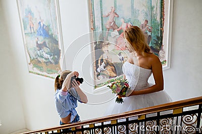 Wedding photographer is shooting portrait of the bride Stock Photo