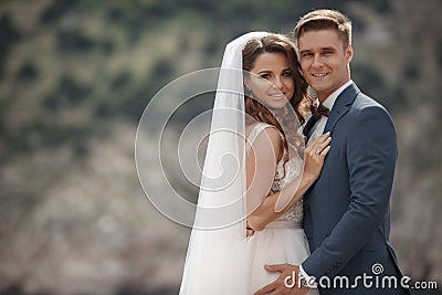 Wedding photography of a young couple, the bride and groom in a mountainous area in summer Stock Photo