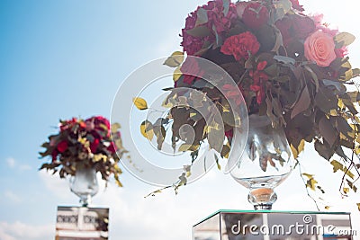 Wedding decor. Wedding registration outdoor. Luxury bouquets with red flowers Stock Photo