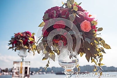 Wedding decor. Wedding registration outdoor. Luxury bouquets with red flowers Stock Photo