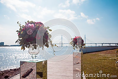 Wedding decor. Wedding registration outdoor. Luxury bouquets with red flowers Stock Photo